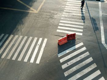 High angle view of zebra crossing on road in city