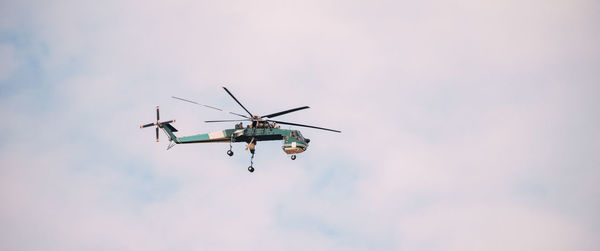 Low angle view of airshow against sky