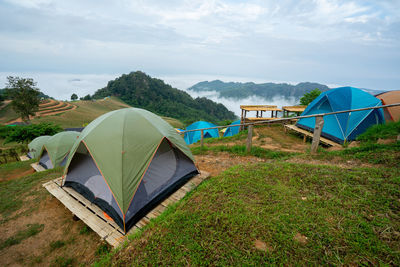 Tent on field against sky