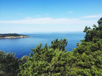 Scenic view of sea against blue sky