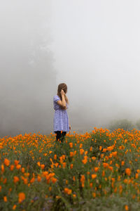 Woman standing on field