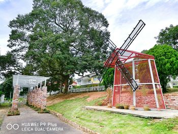 Built structure on countryside landscape against the sky