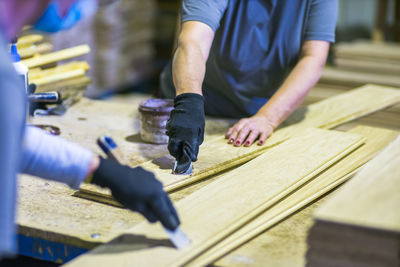 Low section of man working at workshop