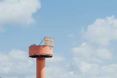 Low angle view of water tower against sky