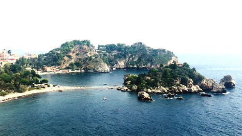 Scenic view of bay against clear sky