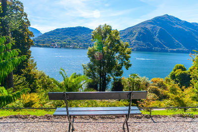 A bench to see the lansdscape of lake of como from garden of villa carlotta, lombardy, italy