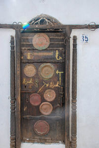 Close-up of old metal door on wall