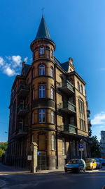Low angle view of building against blue sky