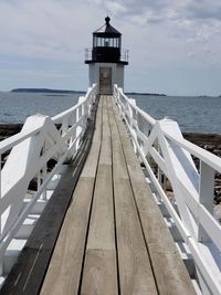 Pier amidst sea against sky