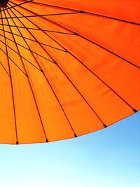 Low angle view of parasol against sky