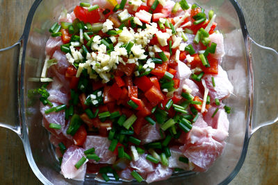 High angle view of chopped fruits in bowl on table