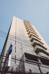 Low angle view of modern building against clear sky