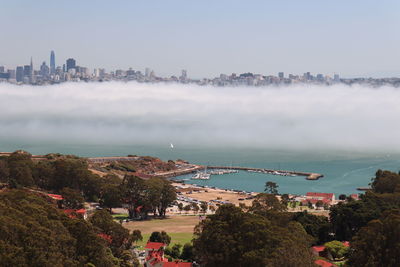 Panoramic view of beach and buildings against sky