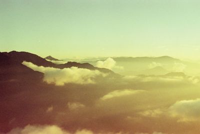 Scenic view of mountains against sky at sunset