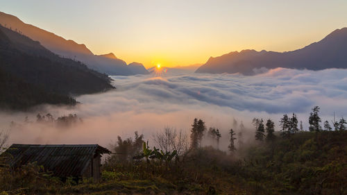 Scenic view of mountains against sky during sunset