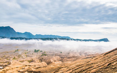 Scenic view of volcanic landscape against sky