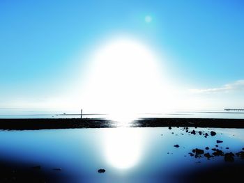 Scenic view of sea against clear blue sky