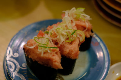 Close-up of sushi served on table