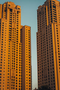 Low angle view of buildings against sky in city