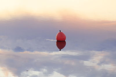 Bouy reflected by water 