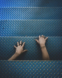 Close-up of people hand by fence