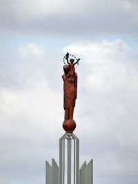 Low angle view of statue against sky
