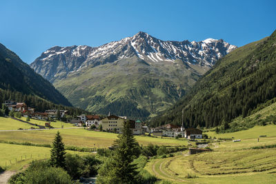 Scenic view of landscape and mountains against sky