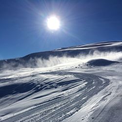 Scenic view of snow covered mountains against clear sky