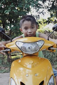 Portrait of boy looking at park