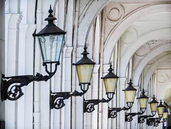 Low angle view of street light against building