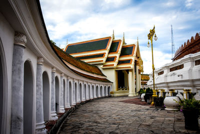 View of street amidst buildings against sky
