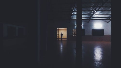 Man in illuminated room