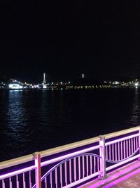 Bridge over river at night