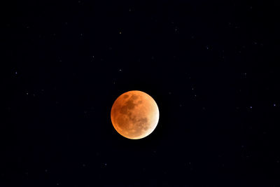 Scenic view of moon against clear sky at night