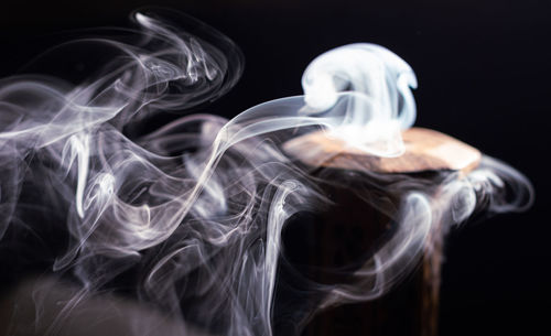 Close-up of smoke against black background