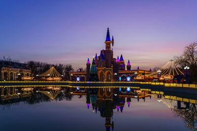 Reflection of illuminated buildings in water