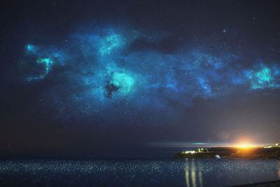 Scenic view of sea against sky at night