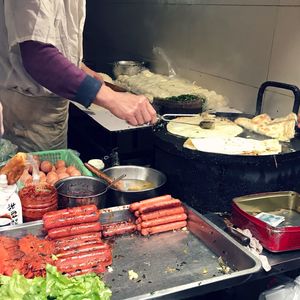 Man working on barbecue grill