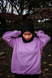 Portrait of a girl standing on field