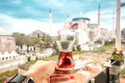 Close-up of hand holding drink