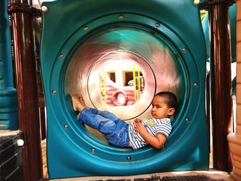 Portrait of cute boy playing in playground