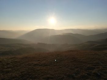 Scenic view of mountains against sky during sunset