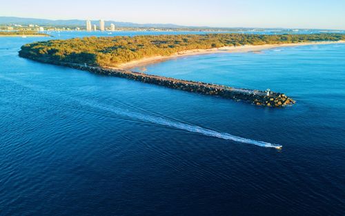 High angle view of sea against blue sky