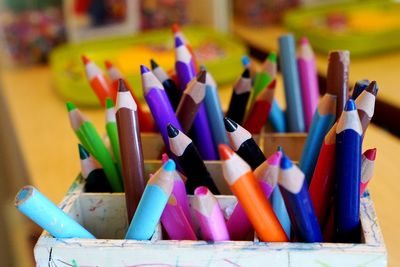 Close-up of colored pencils on table