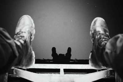 Low section of man sitting on floor