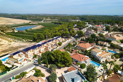 High angle view of swimming pool by buildings in city