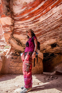 Woman standing in cave