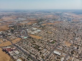 Aerial view of townscape against sky