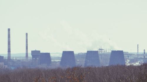 Panoramic view of factory against sky