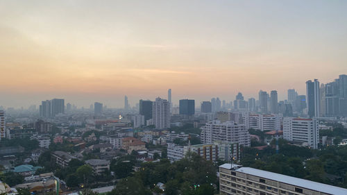 High angle view of buildings against sky during sunset